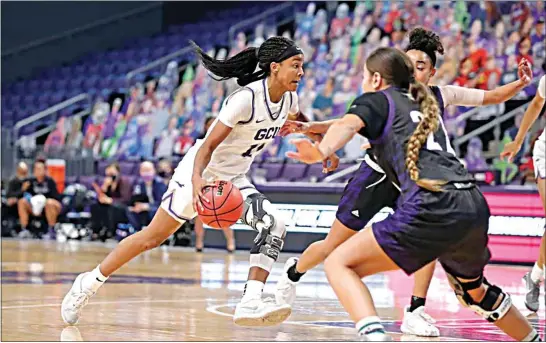  ?? PHOTOS COURTESY OF GRAND CANYON ?? Grand Canyon sophomore point guard Taylor Caldwell, a 2018 BHS graduate, penetrates in Nov. 27’s game against Weber State at the GCU Arena in Phoenix. Caldwell scored 21 points in her first game since suffering a torn ACL in October of 2019.