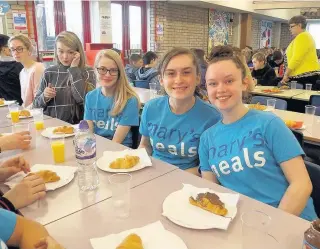  ??  ?? Tucking in Pupils enjoy the French breakfast event