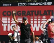  ?? LEE JIN-MAN — THE ASSOCIATED PRESS ?? Tiger Woods celebrates after winning the 2019Zozo Championsh­ip at the Accordia Golf Narashino country club in Inzai, Japan.