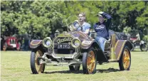  ??  ?? Gently does it . . . Stuart Van Turnhout learns to drive a 1913 Willy's Overland (owned by Phil Boult), supervised by Ryan Boult.