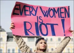  ?? Picture: REUTERS ?? TAKING A STAND: A woman holds a placard during a rally for gender equality and against violence towards women on Internatio­nal Women’s Day yesterday in Kiev, Ukraine.