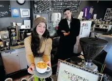  ?? MARK VAN MANEN/PNG ?? Rydé Harding, Small Ritual Coffee Society chairwoman, works with Stephen Olgilvie at the café. The non-profit community hub is recommendi­ng the winner of its essay contest operate the business on a for-profit basis.