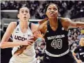  ?? Jessica Hill/Associated Press ?? UConn's Breanna Stewart and South Carolina's Jatarie White look for a rebound during the first half in 2015 in Storrs.