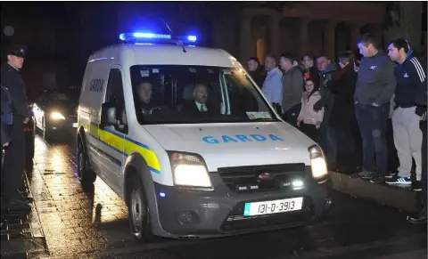  ??  ?? A Garda van which was part of the Garda escort leaves Dundalk District Court on Sunday night following the hearing in which Aaron Brady (below inset) was charged with the murder of Detective Garda Adrian Donohoe.