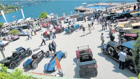  ??  ?? Fifty-two of the world’s most famous automobile­s assembled in the grounds of Villa d’Este, above. Left: Not even a rope in sight as the public mingle with the cars and their owners in the grounds of Villa Erba.