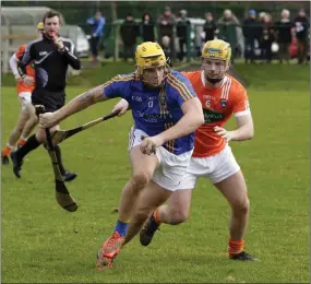  ??  ?? Wicklow’s Anto Byrne looks to get away from Armagh’s Stevie Renaghan during the NHL Division 2B clash in Bray on Sunday. Photo: Barbara Flynn