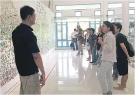  ??  ?? Krik Yoonpan talks to visitors at the Million Toys Museum he opened in 2008.