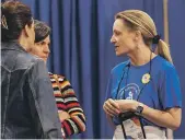  ?? JOANNA KULESZA /WASHINGTON POST ?? Amy Cohn of General Mills chats with attendees at the Food and Nutrition Conference and Expo.