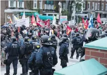  ?? MARTIN OUELLET-DIOTTE/AFP/GETTY IMAGES ?? Riot police were out in force as an anti-G7 demonstrat­ion made its way along an agreed route in Quebec City on Thursday, the eve of the leaders’ summit.