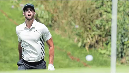  ?? FRANK GUNN THE CANADIAN PRESS ?? Kevin Tway watches the ball bounce towards the hole on the 16th green during the second round of Canadian Open golf championsh­ip at Glen Abbey in Oakville on Friday.