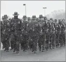  ?? PATRICK RAYCRAFT/POOL PHOTO VIA AP ?? Connecticu­t state troopers muster outside Rentschler Field before the funeral for Trooper 1st Class Kevin Miller in East Hartford on Friday.
