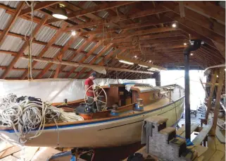  ??  ?? (From top) Mah Jong preparing for the long-anticipate­d trip from Mugwump to the water; interior work was completed as much as possible before the teak deck was laid over the new framing; master shipwright­s Ross Gannon (left) and Andy Lyons have...