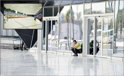  ?? Photos by Mohammad Morsi ?? Kuwait Internatio­nal Airport wears a deserted look (inset) as the flow of incoming passengers remains scarce. Member of the Board of Directors of Tourism and Travel Offices Hussein Al-Sulaiten said the decisions to increase the daily quota of arriving passengers at Kuwait Internatio­nal Airport to 10,000 and resumption of direct flights for the two largest expatriate communitie­s in the country – Egyptians and Indians – will have a significan­t impact on ticket prices in the future as prices are expected to go down; especially for transit flights from the United Arab Emirates (UAE), Qatar and countries that citizens usually use as transit points for their flight to Kuwait, reports Al-Anba daily.