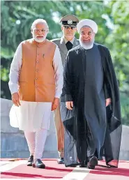  ??  ?? president.ir Iranian President Hassan Rouhani (R) walks with Indian Prime Minister Narendra Modi during an official welcoming ceremony at the Sa’dabad Palace in Tehran on May 23, 2016.