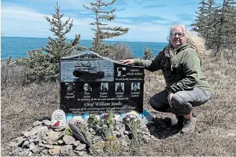  ?? LORI PHILLIPS THE CANADIAN PRESS ?? Lori Phillips crouches by the monument rememberin­g her son, Aaron Cogswell, and the others aboard the Chief William Saulis when it went down in 2020.