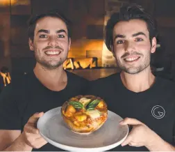  ??  ?? Ali and James Carney with the famous Gemelli Italian pizza bowl.