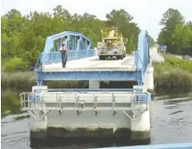  ?? CONTRIBUTE­D PHOTO ?? Florida Department of Transporta­tion workers open the U.S. 17 bridge spanning the St. Marys River for maintenanc­e.