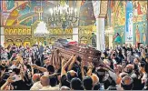  ?? AFP ?? Palestinia­n mourners wave national flags as they carry the casket of Shireen Abu Aklel inside a church, in Jerusalem,