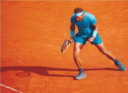  ?? AP FOTO/CHRISTOPHE ENA ?? VAMOS. Rafael Nadal celebrates after a straight sets win over Juan Martin del Potro in the French Open semifinals.