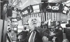  ?? SPENCER PLATT GETTY IMAGES ?? Traders work on the floor of the New York Stock Exchange (NYSE) moments before the Closing Bell in New York City. As Wall Street continues to worry about future inflation and rising interest rates, the Dow Jones Industrial Average fell over 1,000...