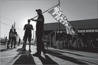  ?? ROSS D. FRANKLIN/AP PHOTO ?? Supporters of President Donald Trump rally outside the Maricopa County Elections Department as the agency conducts a post-election logic and accuracy test for the general election Wednesday in Phoenix.