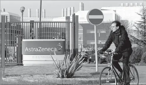  ?? REUTERS ?? A worker leaves the AstraZenec­a research facility in Loughborou­gh, the United Kingdom.