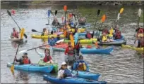  ?? DIGITAL FIRST MEDIA FILE PHOTO ?? Kayaks get together for a group photo before paddling the Schuylkill River in April 2016. Sly Fox Brewery is hosting its annual SRT Spree this weekend to mark the launch of its season SRT Ale to benefit the Schuylkill River Trail. Kayakers will paddle Saturday from Riverfront Park in Pottstown to Lock 60 in Mont Clare.