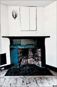  ?? SARAH COLE ?? Sarah Cole is restoring the interior of the James Blake House to make it more livable for caretaker Barbara Kurze. Shown here is the central fireplace in the kitchen.