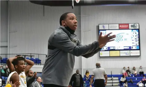  ?? Commercial/I.C. Murrell) (Pine Bluff ?? Watson Chapel boys basketball Coach Marcus Adams works the sideline during a March 4 regional tournament game against Hope at the Star City High School arena.