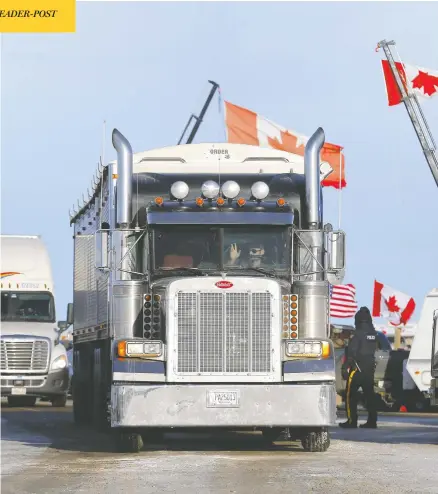  ?? DARREN MAKOWICHUK / POSTMEDIA NEWS FILES ?? Trucks block the road on Highway 4 and 501 outside of Milk River toward the U.S. border crossing near Coutts, Alta., on Feb. 4.