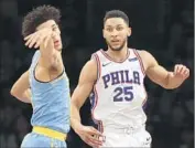  ?? Gina Ferazzi Los Angeles Times ?? BEN SIMMONS, right, got the better of the Lakers’ Lonzo Ball in their f irst matchup in the NBA.