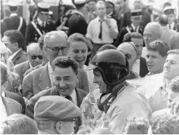  ??  ?? Above: Mobbed by the crowd after his win at Rouen in 1962, Gurney was accompanie­d by Huschke von Hanstein in cap in the foreground
Above right: After having completed an excellent pre-race test, Gurney finished a frustrated third in a wet German Grand Prix only 4.4 seconds behind winner Graham Hill’s BRM (11).