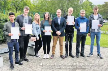  ??  ?? Students from Ormiston Bolingbrok­e Academy in Runcorn celebrate A-level results day