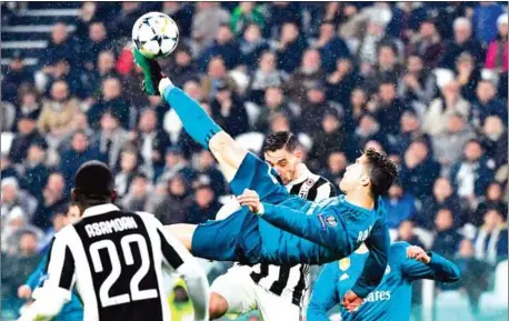 ?? AFP ?? Real Madrid forward Cristiano Ronaldo scores with an overhead bicycle kick during their UEFA Champions League quarterfin­al first leg with Juventus at the Allianz Stadium in Turin on Tuesday night.