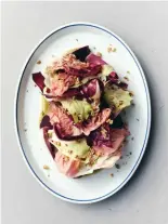  ??  ?? The radicchio and beet salad offers a bitter counterpoi­nt to the richer fare on the menu inside the revamped Paradise Cinema