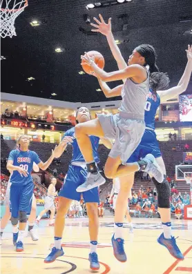  ?? MARLA BROSE/JOURNAL ?? Mykiel Burleson goes airborne on a drive to the basket for New Mexico during the Lobos’ 64-49 win over SMU at the Pit. Burleson scored eight points.