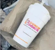  ??  ?? In this file photo, a Dunkin’ Donuts foam cup is discarded in a trash bin in New York.