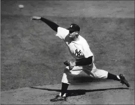  ?? THE ASSOCIATED PRESS, FILE ?? The Yankees’ Don Larsen delivers a pitch in the fourth inning of Game 5against the Brooklyn Dodgers in the World Series en route to the first World Series perfect game on Oct. 8, 1956. The Yankees won 2-0and went on to win the series. Larsen, the journeyman pitcher who reached the heights of baseball glory in 1956for the Yankees when he threw a perfect game and the only no-hitter in World Series history, died Wednesday night. He was 90.