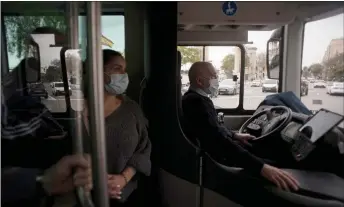  ?? — AFP photo ?? A driver sits on the first electric-powered and autonomous 12-metre passenger bus of Europe during testing in Malaga. In previous projects, self-driving tests have been carried out using smaller vehicles, not the standard 12-metre buses.