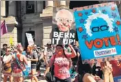  ?? AFP ?? Bernie Sanders supporters prepare to march on the first day of the Democratic National Convention in Philadelph­ia on Monday.