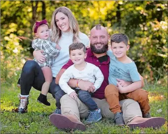  ?? PHOTO COURTESY OF THE SHERMAN FAMILY ?? Anthony and Jessica Sherman pose for a family portrait with 5-year-old son Rex, 3-year-old son Bo and 20-month daughter Remi earlier this year in Overland Park, Kansas.