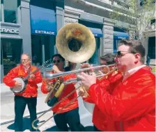  ?? AP PHOTO/STEVE LEBLANC ?? Dan Gabel, right, and fellow musicians perform in downtown Boston earlier this month. Gabel has canceled Netflix and other streaming services and tried to cut back on driving as the costs of gas, food and other items, such as the lubricants he uses for his instrument­s, has soared. In the photo, from left to right, are Eric Baldwin, banjo; Ed Goroza, sousaphone; Josiah Reibstein, trombone; and Gabel, trumpet.