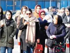  ?? ATTA KENARE/AFP AFP ?? Iranian women wearing hijab walk down a street in the capital Tehran on Wednesday.