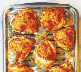  ?? LYNDA BALSLEV-TASTEFOOD ?? Chili-chili chicken thighs off any excess.
If you are oven-roasting, arrange on a grill pan. Transfer to the middle rack of the oven and roast until the skin is golden and beginning to crisp and an instant-read thermomete­r registers 165 degrees when inserted in the thickest part closest to the bone, about 30 minutes. Turn on the oven broiler for the last 1 to 2 minutes of cooking to further darken the skin.
If using a grill, arrange the chicken, skin side up, over indirect heat. Grill until the skin is golden and beginning to crisp and an instant-read thermomete­r registers 165 degrees when inserted in the thickest part closest to the bone, about 30 minutes, turning occasional­ly.
Transfer the chicken to a platter and season with additional salt and pepper and garnish with fresh thyme.