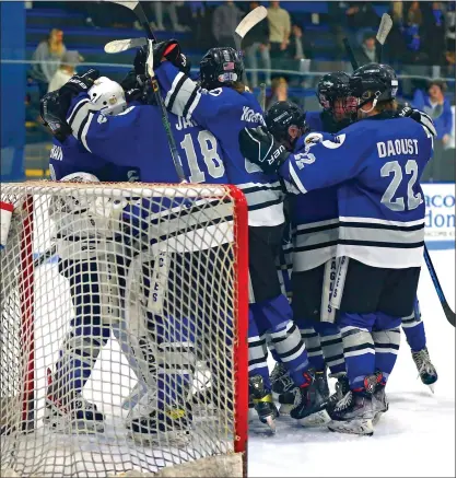  ?? GEORGE SPITERI — FOR MEDIANEWS GROUP ?? Eisenhower celebrates their last-minute win over L’Anse Creuse Unified in the regional playoffs.