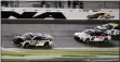  ?? TERRY RENNA - THE ASSOCIATED PRESS ?? Aric Almirola crosses the finish line ahead of Austin Cindric (2) and Chase Elliott (9) to win the second of two qualifying auto races for the NASCAR Daytona 500at Daytona Internatio­nal Speedway on Thursday.