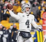  ?? Matt Durisko/Associated Press ?? Las Vegas Raiders quarterbac­k Derek Carr throws a pass during a game against the Pittsburgh Steelers on Dec. 24 in Pittsburgh.