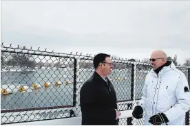  ?? ALLAN BENNER THE ST. CATHARINES STANDARD ?? Ontario Power Generation project manager Mark Armstrong speaks with Steve Repergel at the mouth of the Welland River.