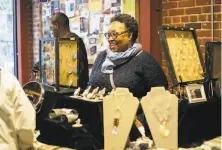  ?? Sareya Shorter / Reya Photograph­y 2019 ?? Oakland artist Karen Smith sells her jewelry at Just Be’s For the Culture holiday market in 2019. This year’s event is online.