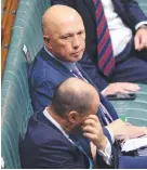  ??  ?? Peter Dutton in parliament with Treasurer Josh Frydenberg.